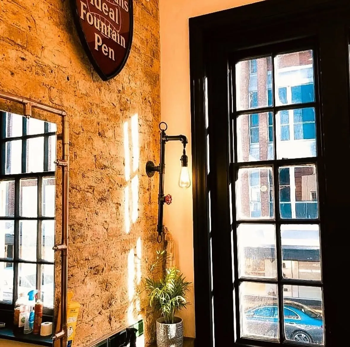 A sash window and brick wall inside The Pavement